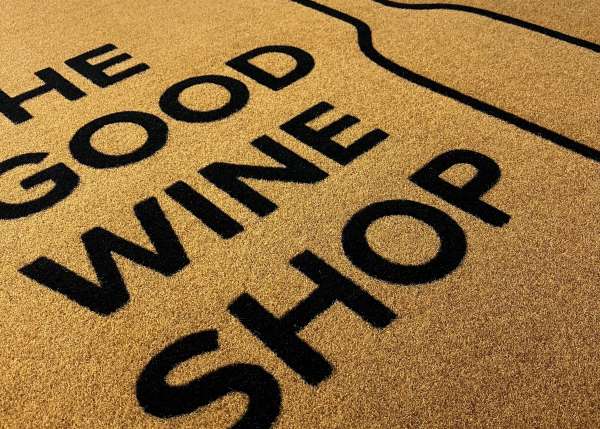 A Synthetic Coir Doormat with The Good Wine Shop logo