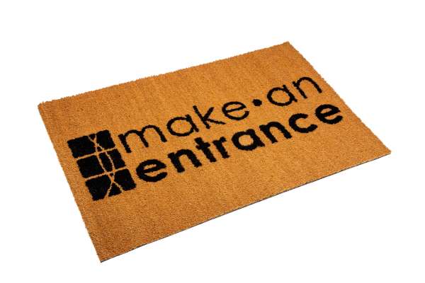 A Coir Logo Mat featuring the Make An Entrance Logo