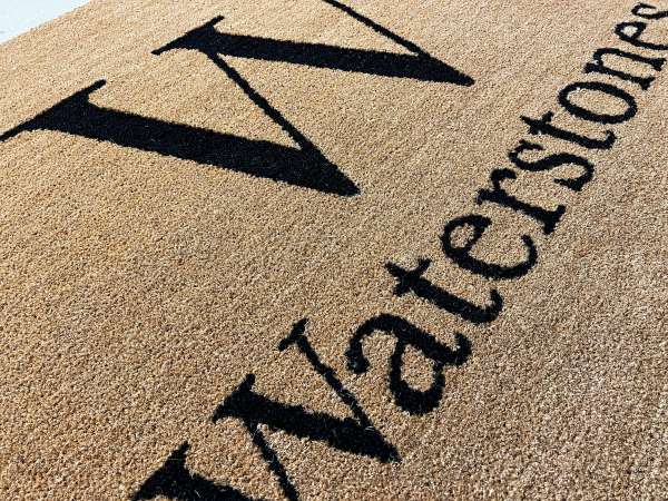 An inlaid Coir Mat with the Waterstones Logo